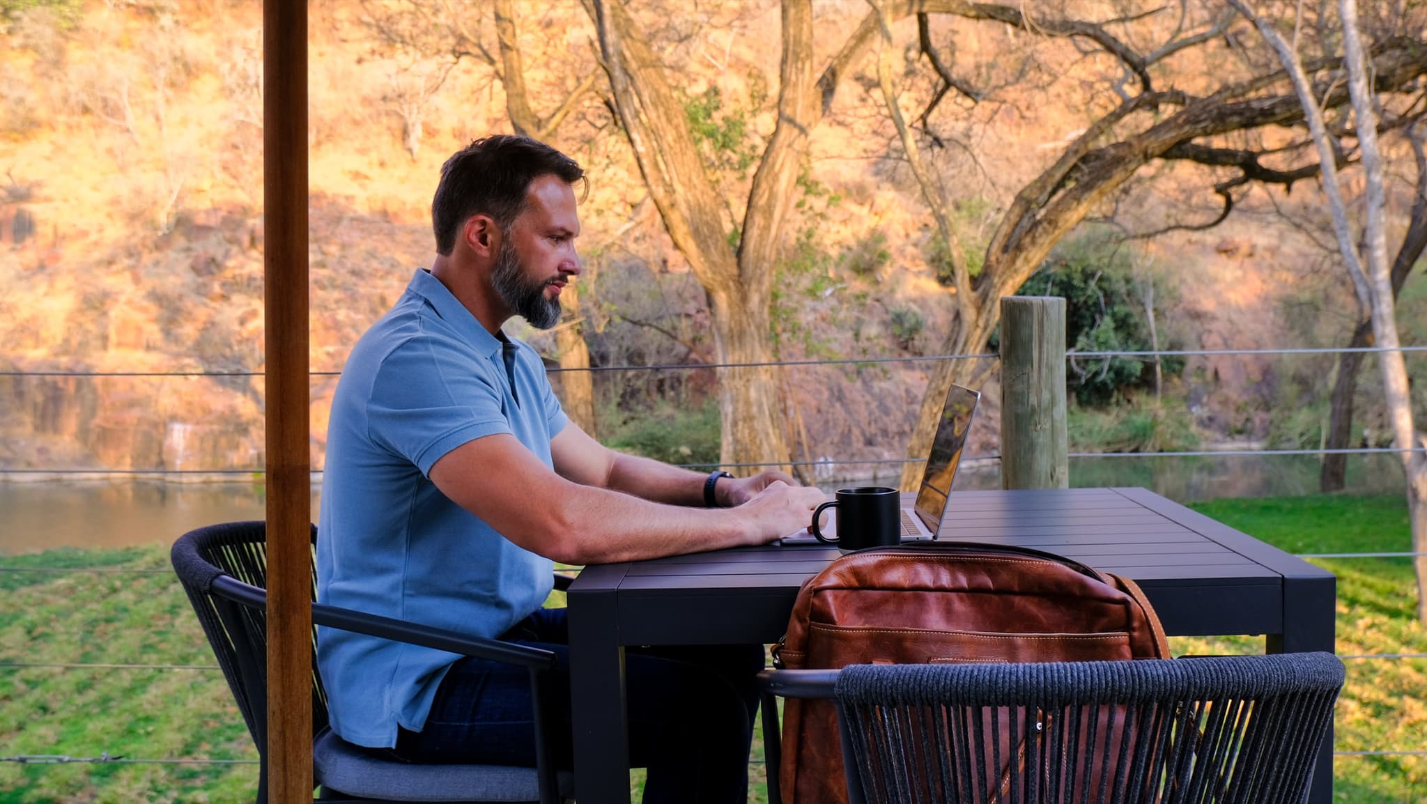 Remote work from the deck with river and hillside views