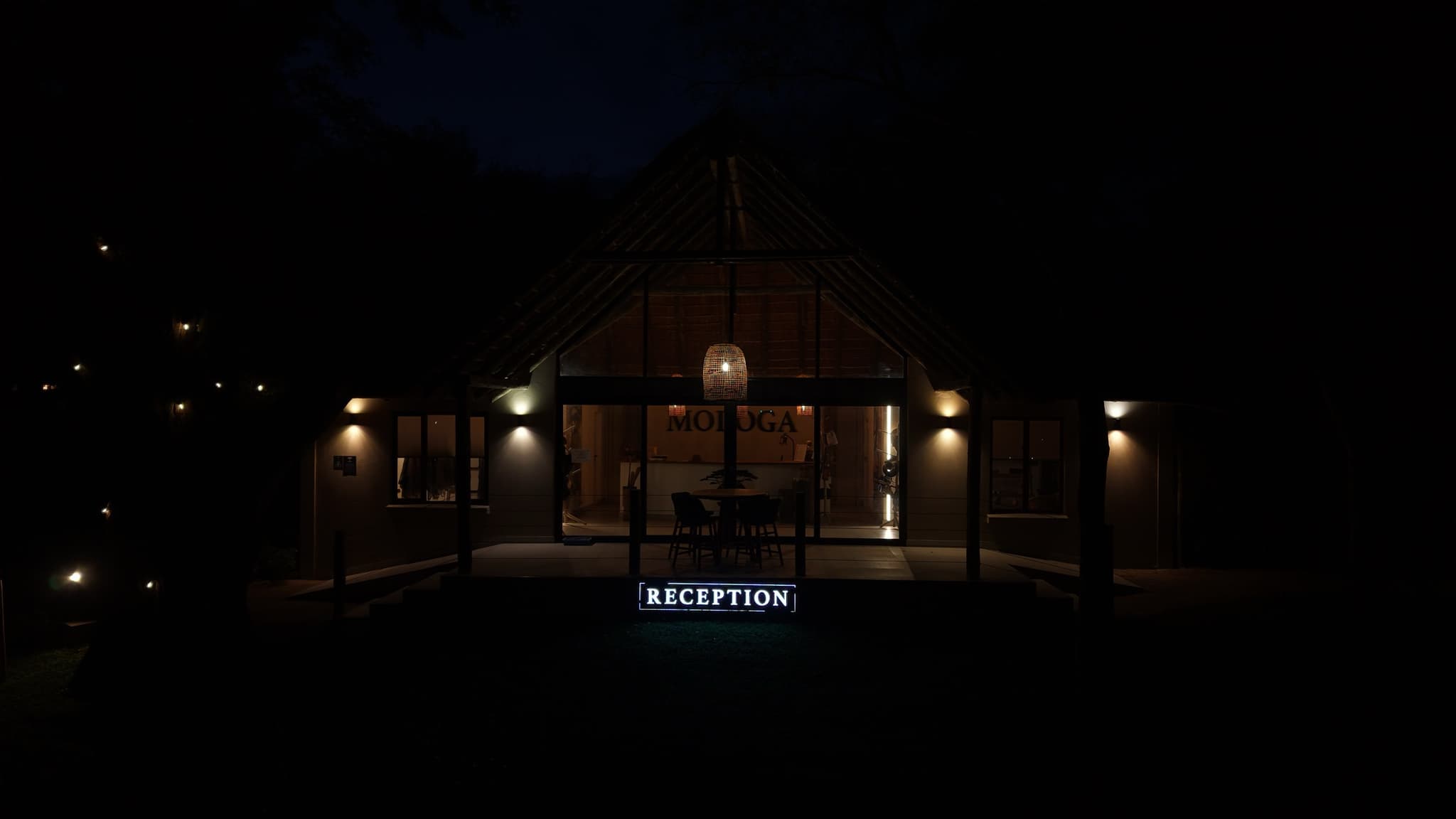 Lodge reception lit up at night with warm glow
